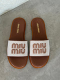 Miu Miu Canvas and leather slide