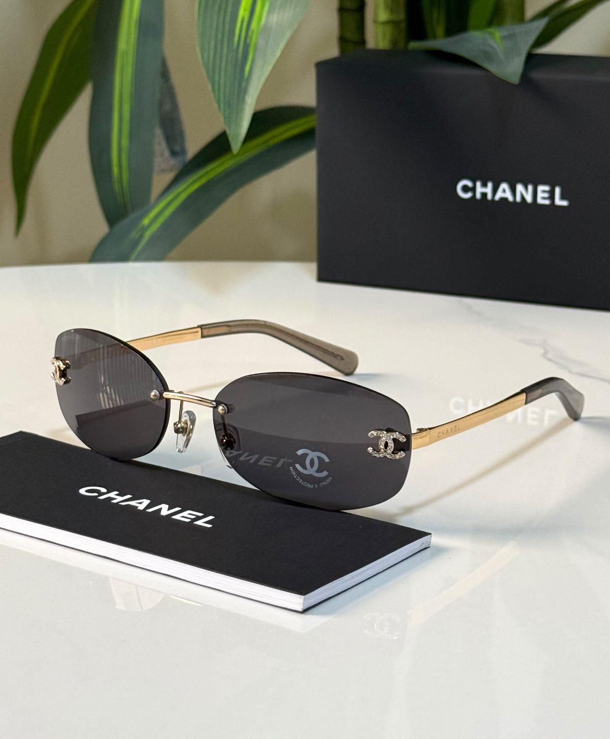 Chanel Rimless Crystal CC Oval Sunglasses