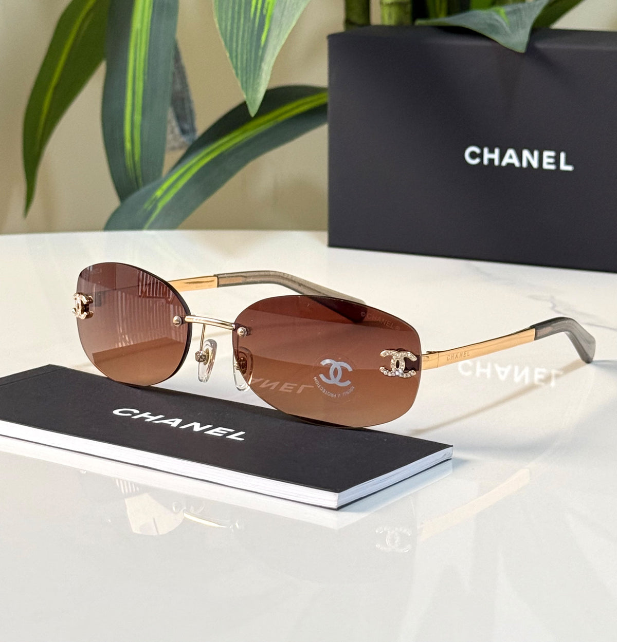 Chanel Rimless Crystal CC Oval Sunglasses