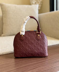 Louis Vuitton Alma BB in Monogram Empreinte Leather Bag